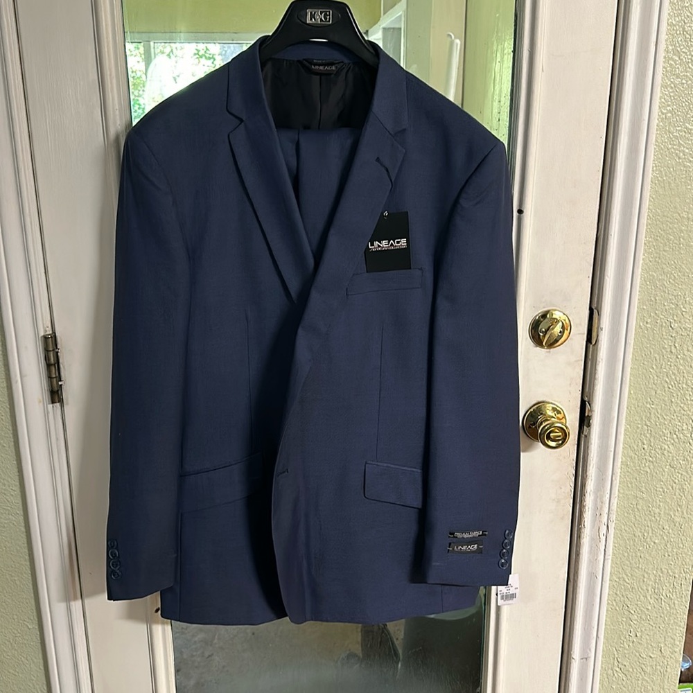Navy blue “men’s” suit NWT never worn.